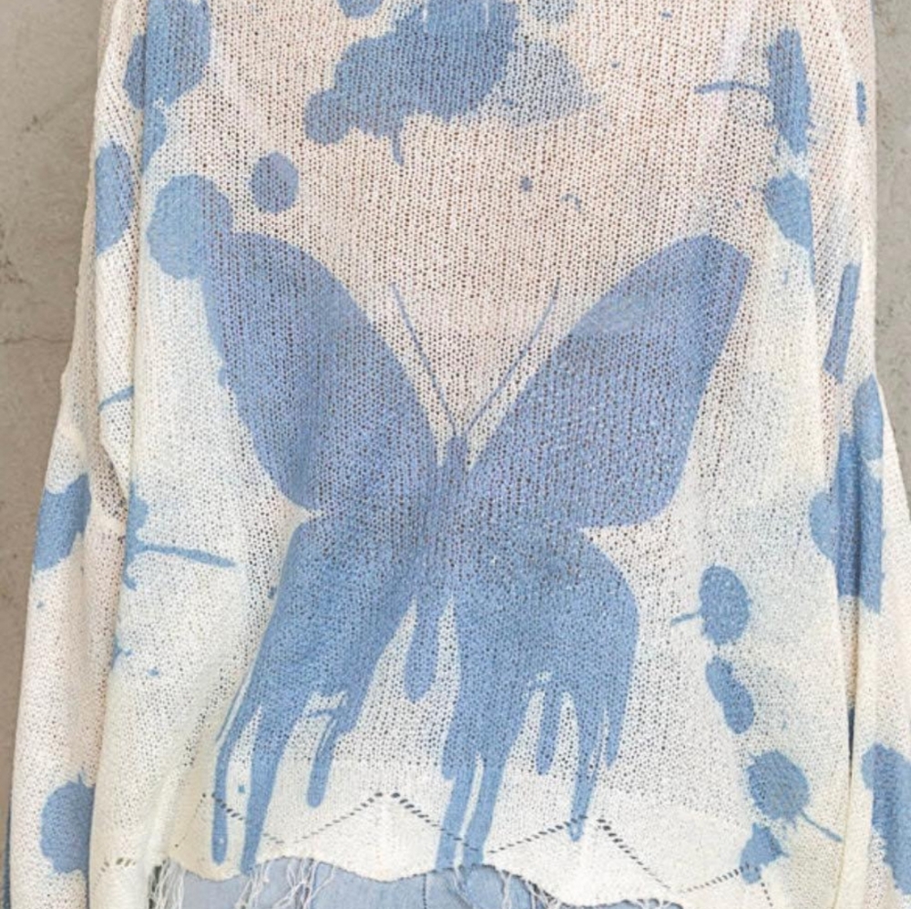 Summer sweater with blue butterflies.
